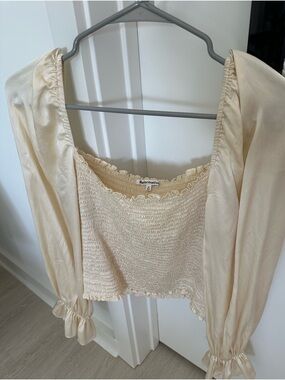 Reformation 100% silk cream blouse with ruffled sleeves, size M